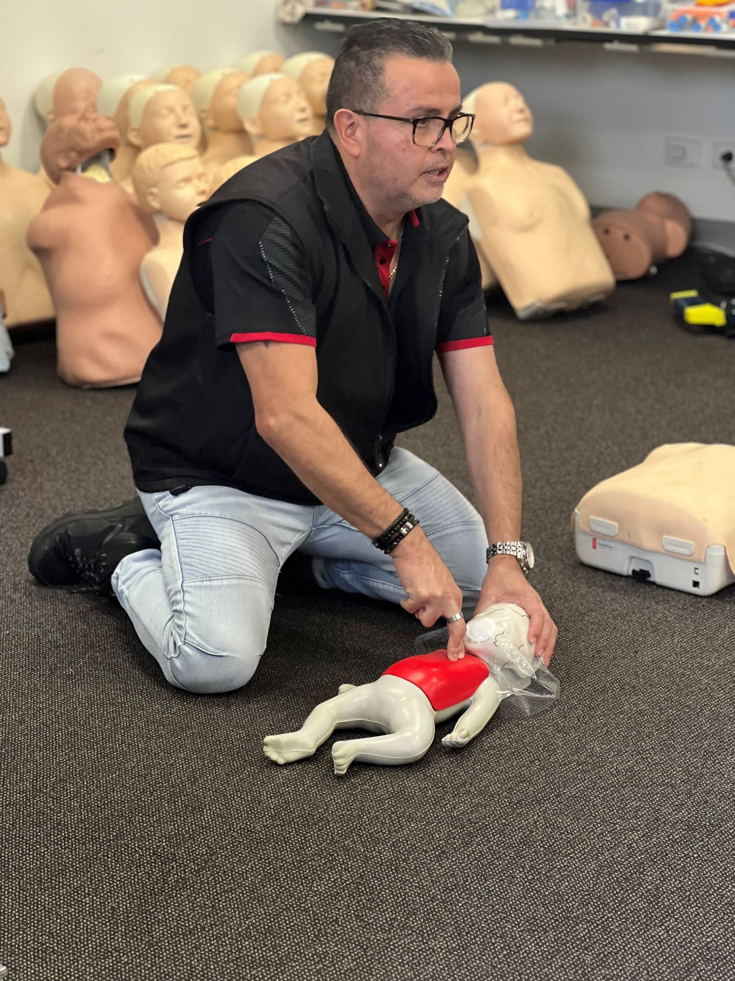 Parent learning first aid techniques for babies and young children